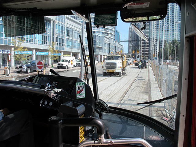 Oct 07, 2014/Toronto, ON:   TTC. EB #4164. Queens Quay at Simcoe St. First car to Union, testing track & overhead structure.